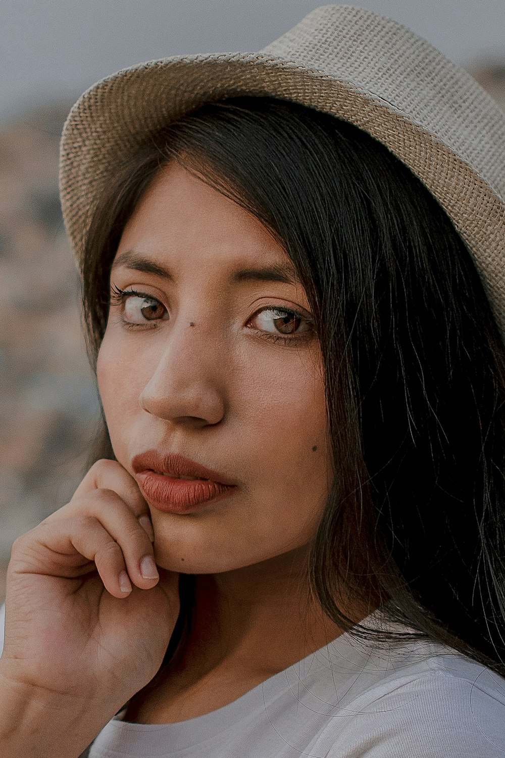 a close up of a person wearing a hat