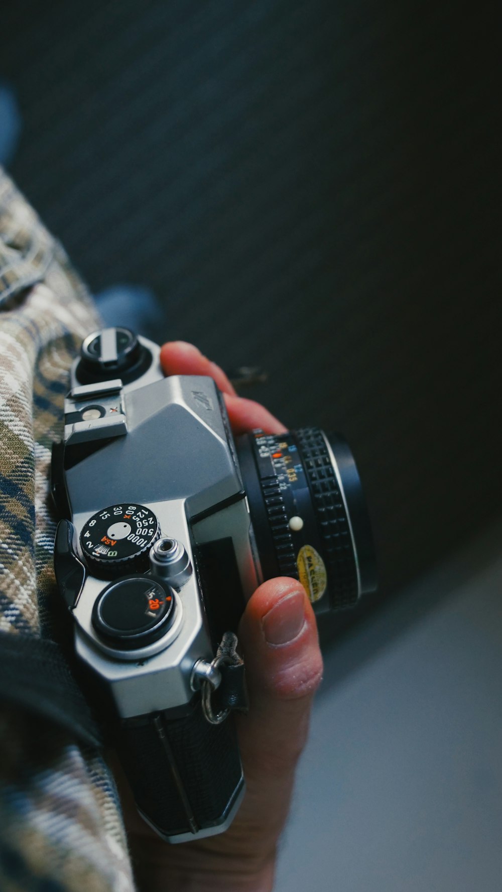 a person holding a camera in their hand