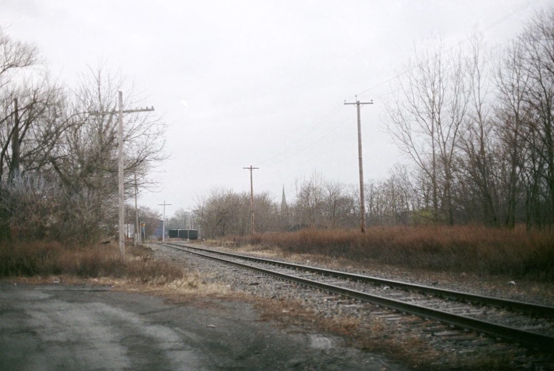 a railroad track with a train on it,