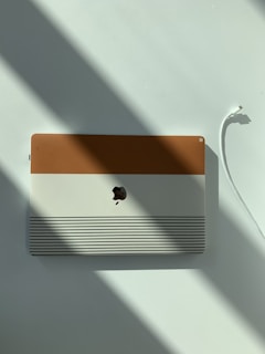 an apple computer sitting on top of a white table