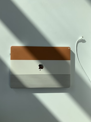 an apple computer sitting on top of a white table