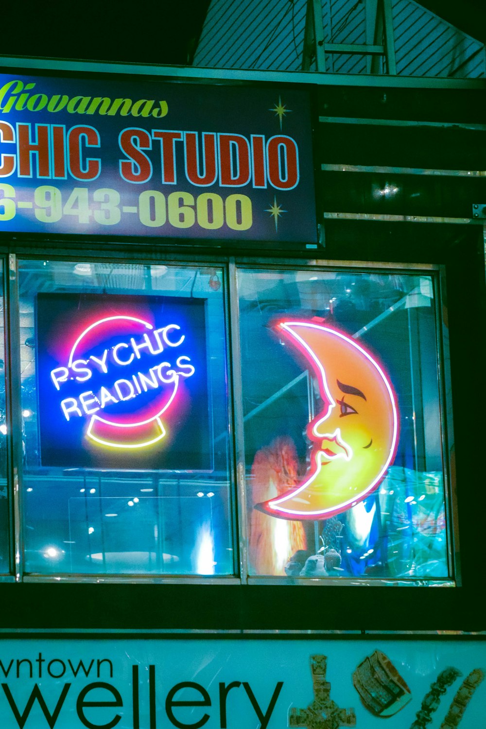 a neon sign in a window of a psychic shop