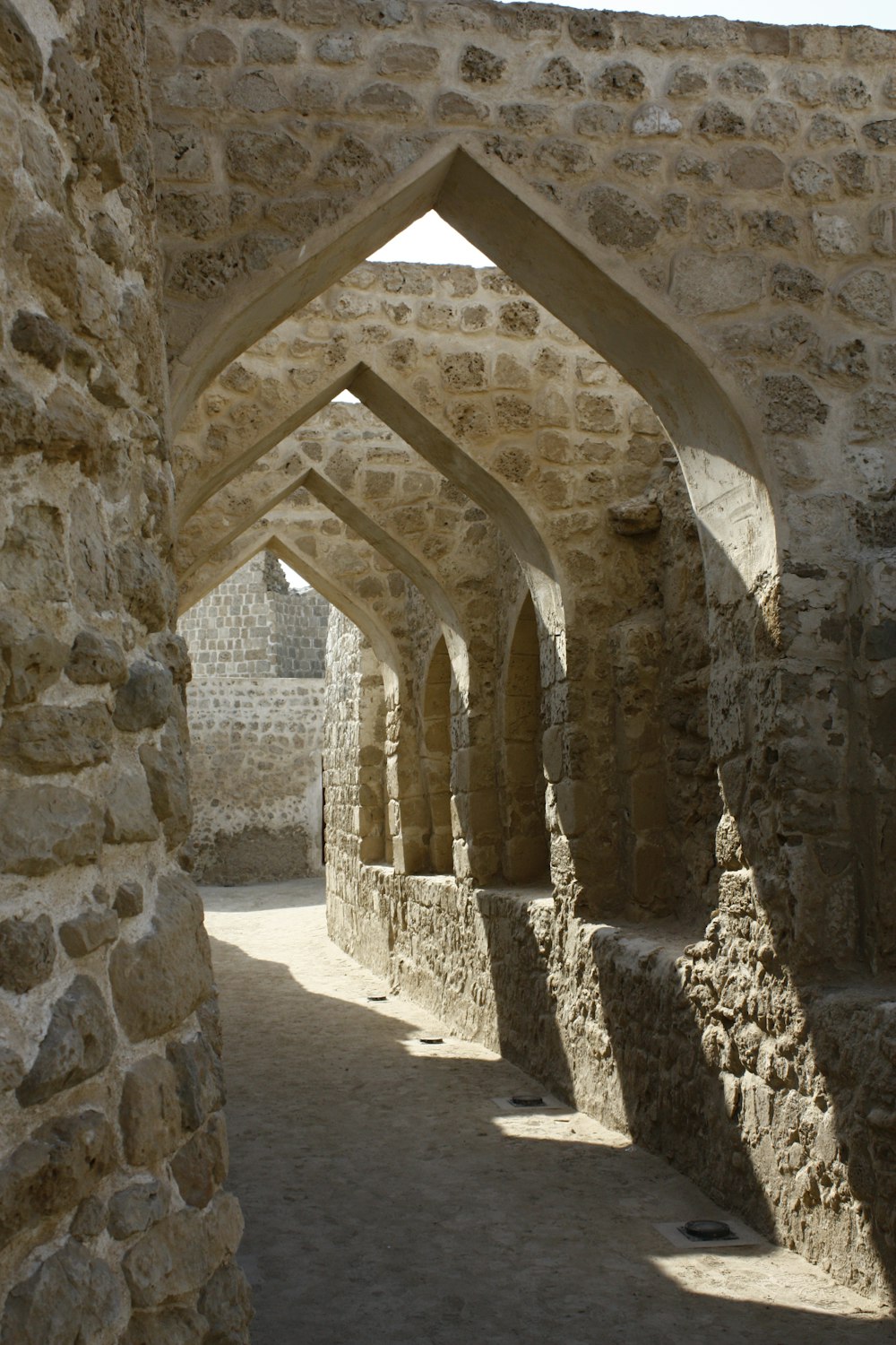 a narrow passageway between two stone buildings