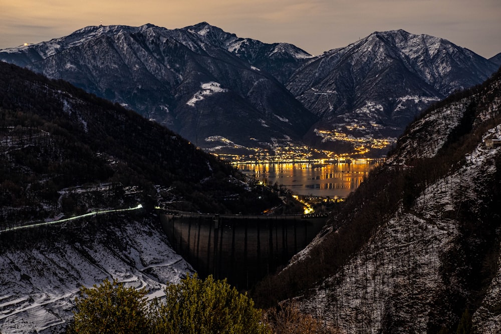 a view of a mountain range with a city in the distance