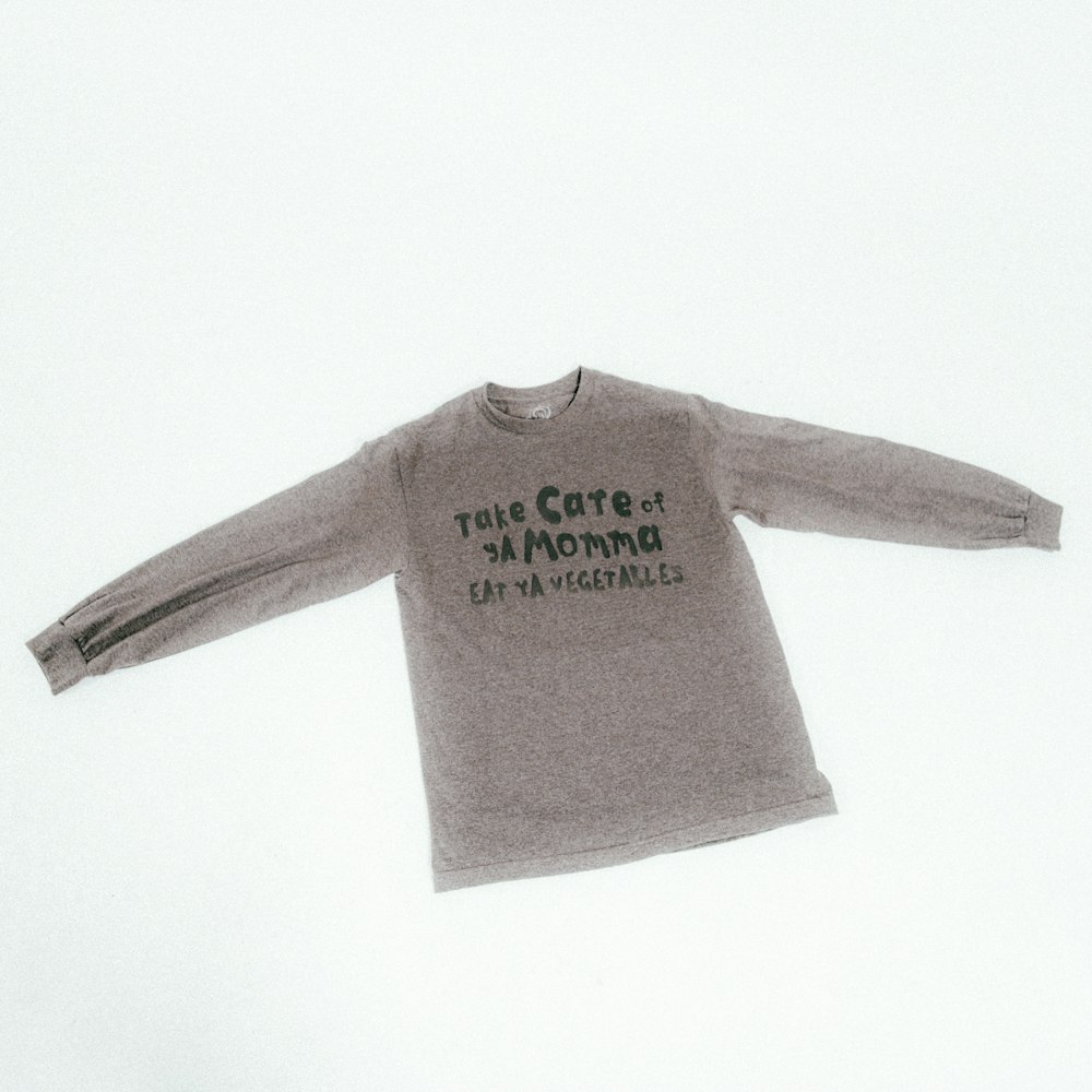 a long sleeved shirt with the words true care on it