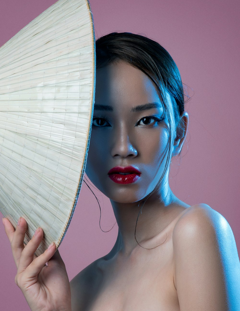 a woman holding an umbrella over her head