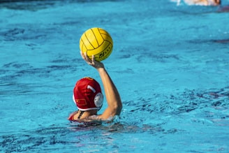 Photo of a sturdy water polo goal set up in a swimming pool on a sunny day.