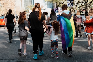 a group of people walking down a street