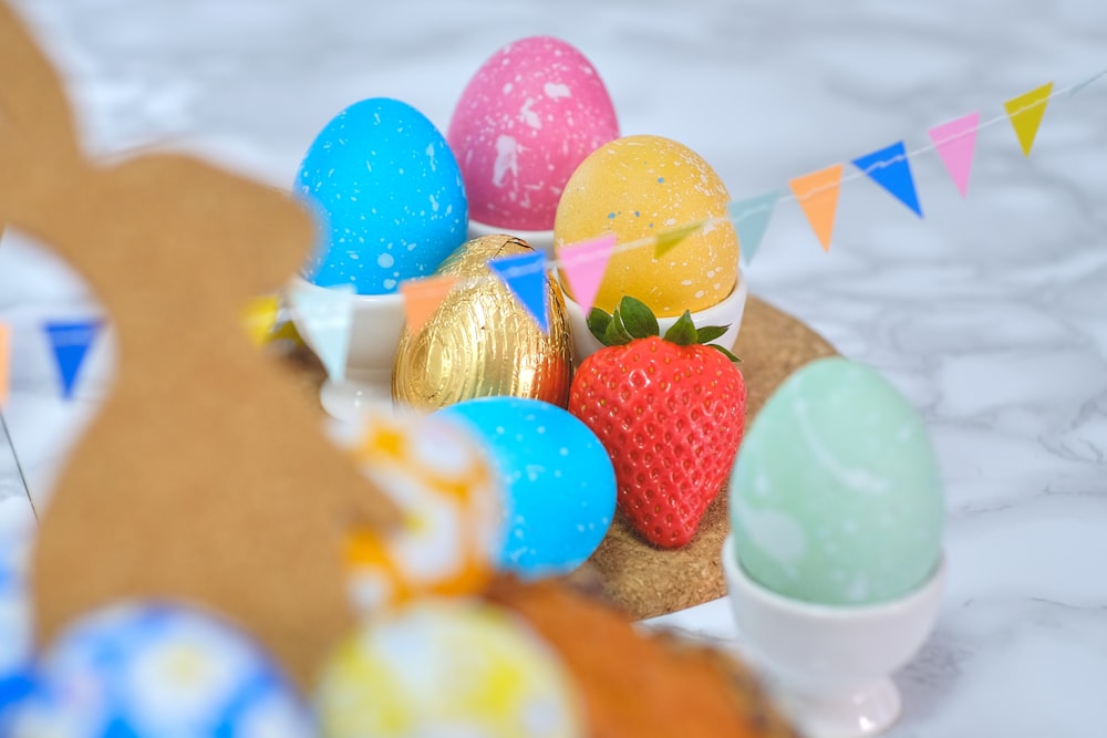 a close up of a plate of eggs and strawberries