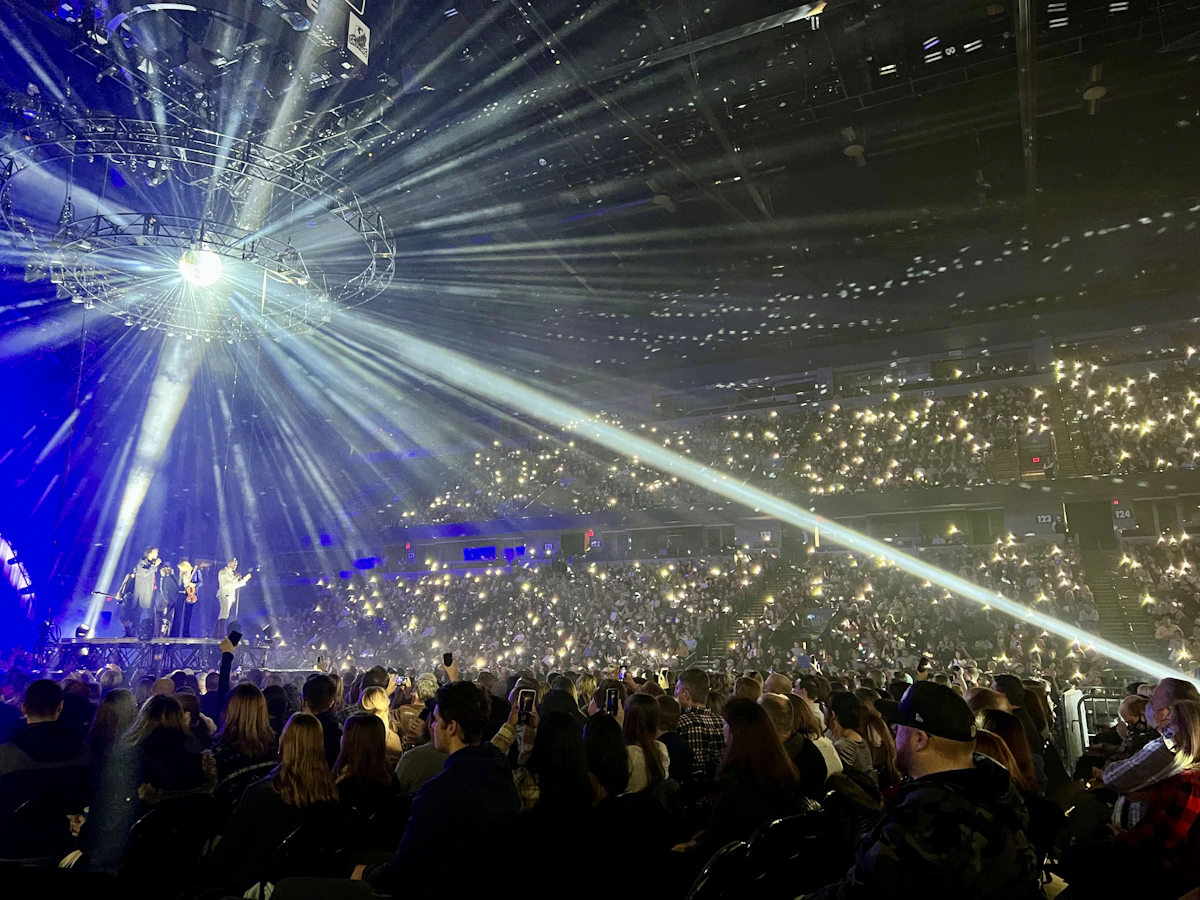 Concert venue filled with fans and stage lights