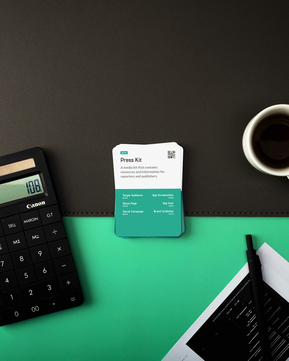 a calculator and a cup of coffee on a table