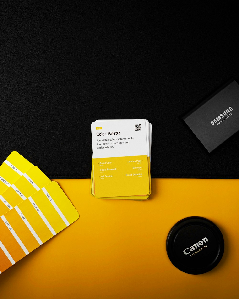 a yellow and white business card sitting on top of a yellow table