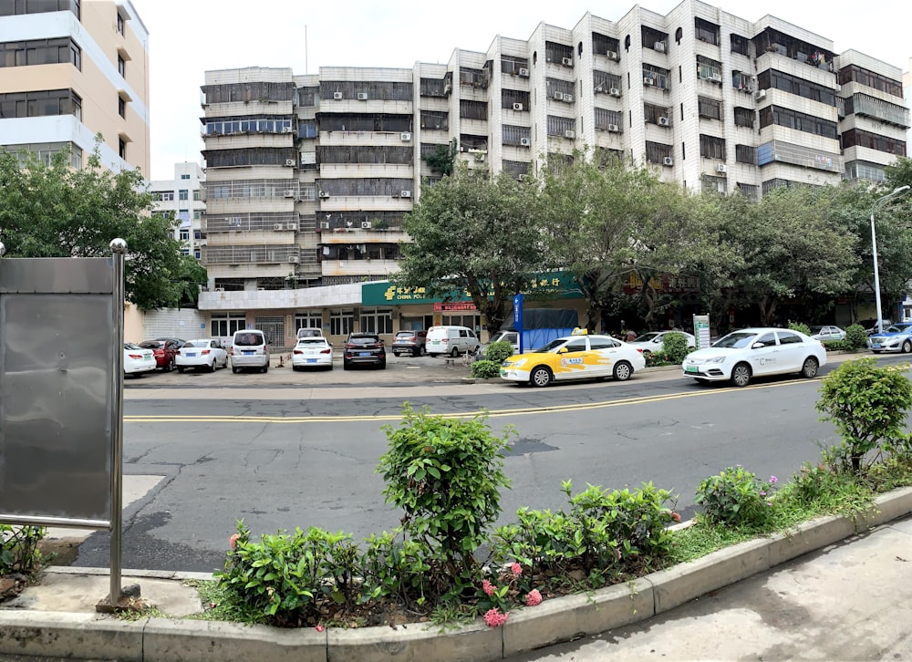 a city street with cars parked on the side of the road