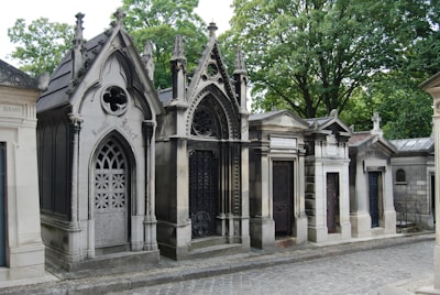 a row of old tombstones in a cemetery