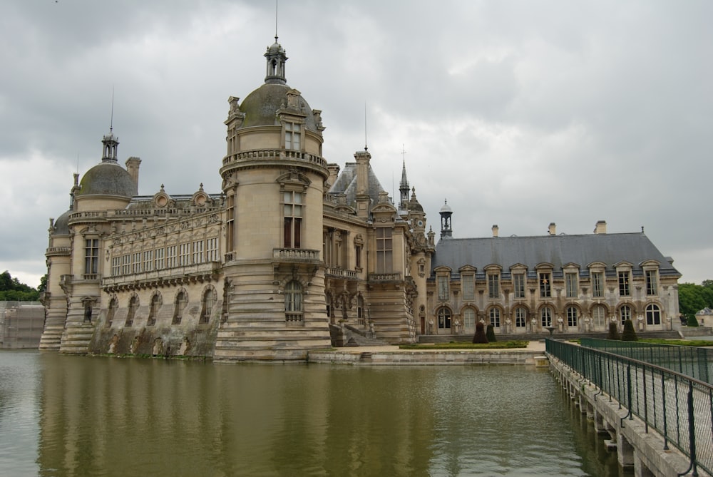 a large building sitting next to a body of water