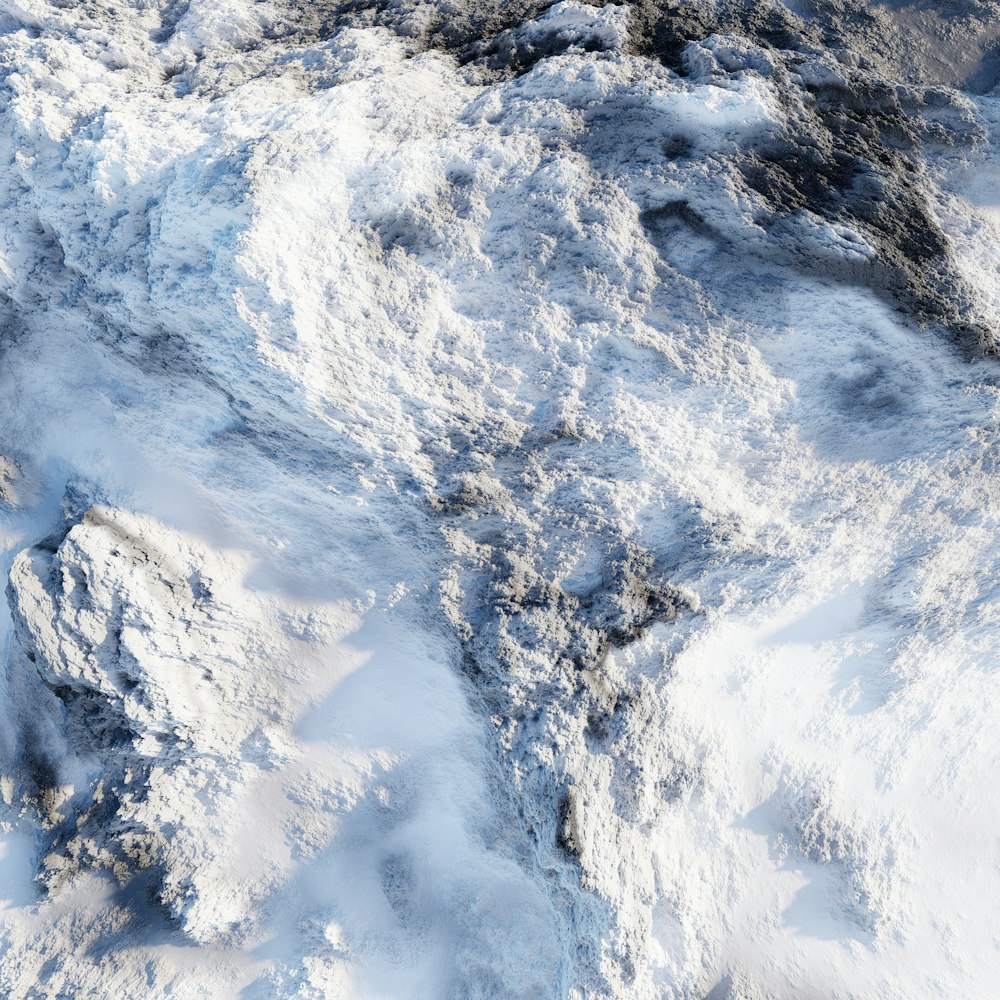 an aerial view of a snow covered mountain