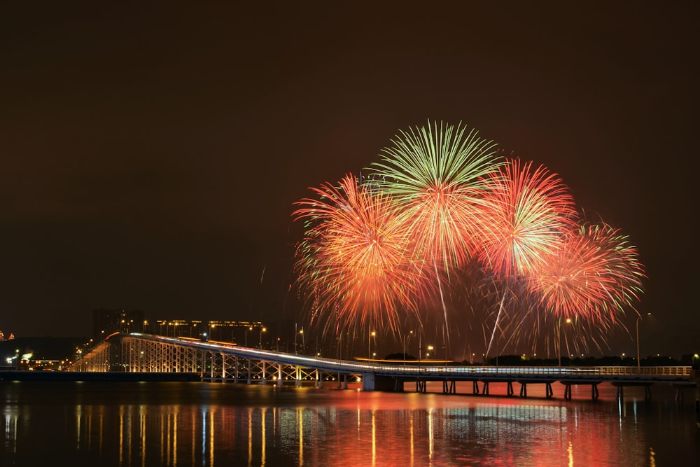 a large fireworks display over a body of water