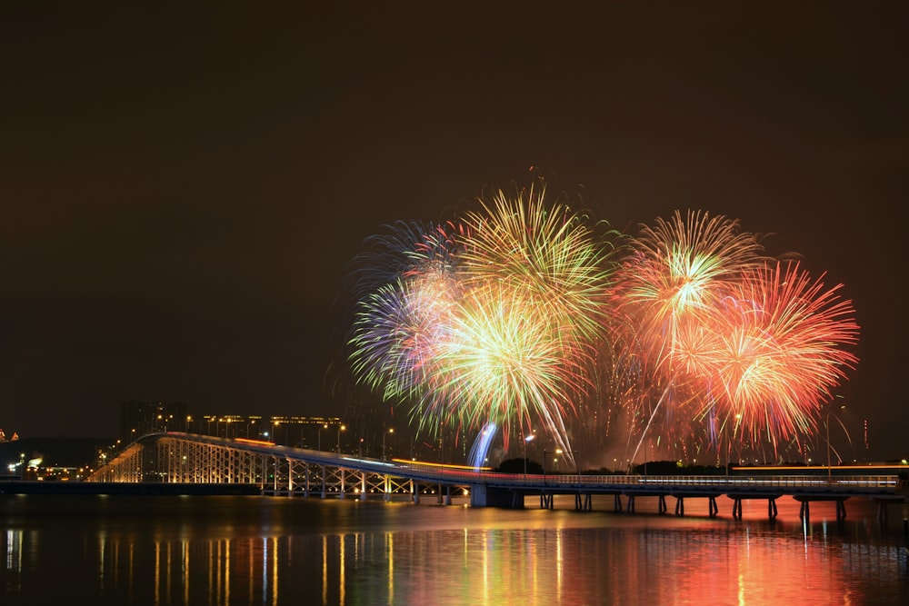a large fireworks display over a body of water