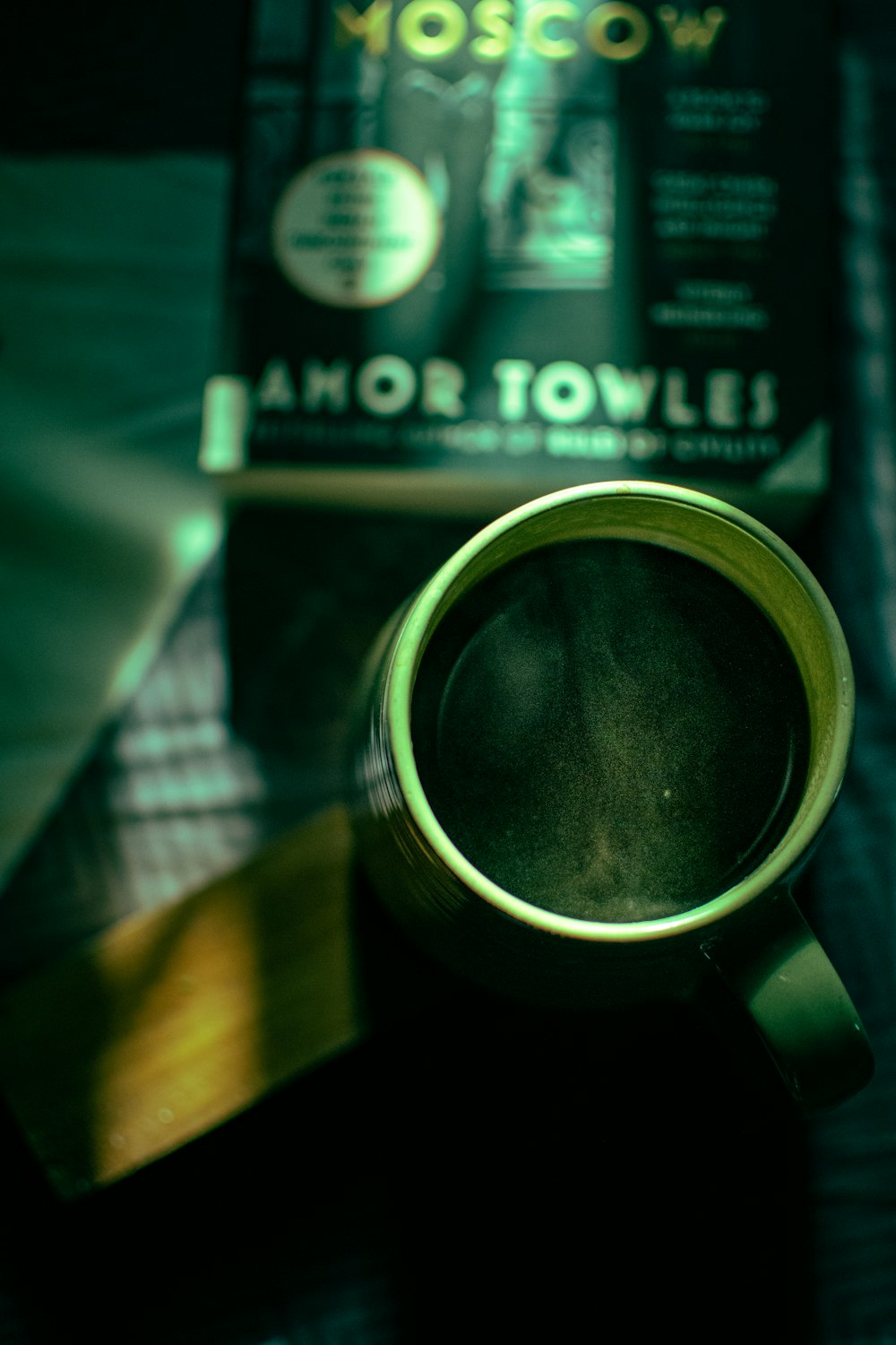 a cup of coffee sitting on top of a table