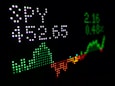 digital stock ticker chart symbolizing investments and investing in stocks, bonds, etfs, and more