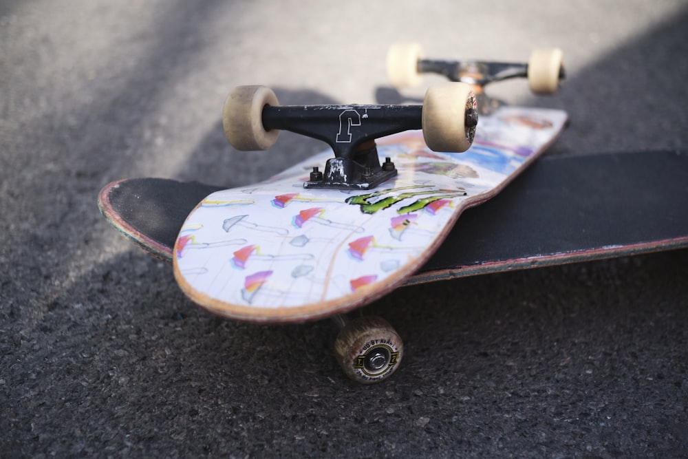 a close up of a skateboard on the ground