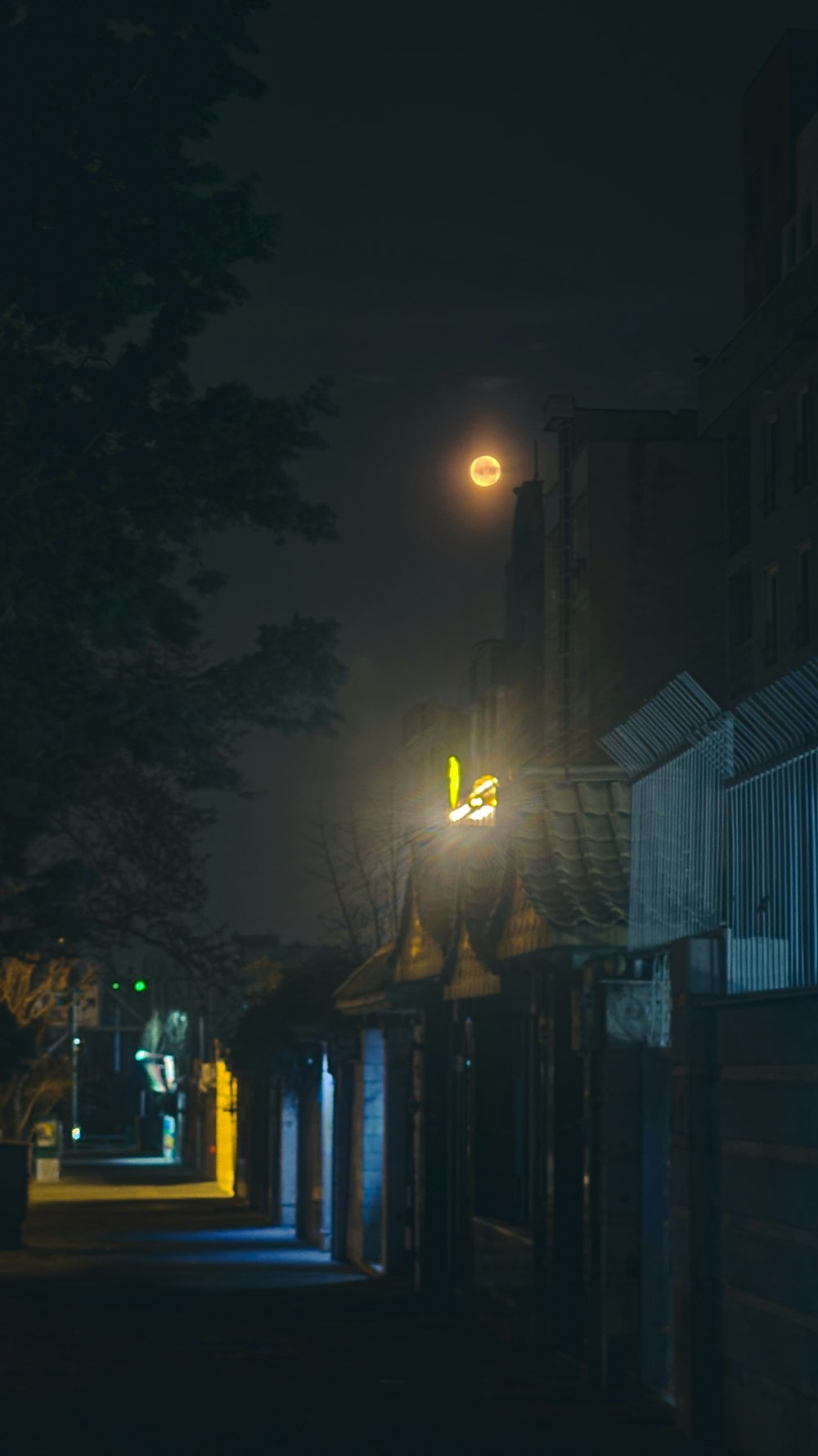 a street at night with a street light on