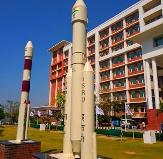 a large rocket sitting on top of a brick block