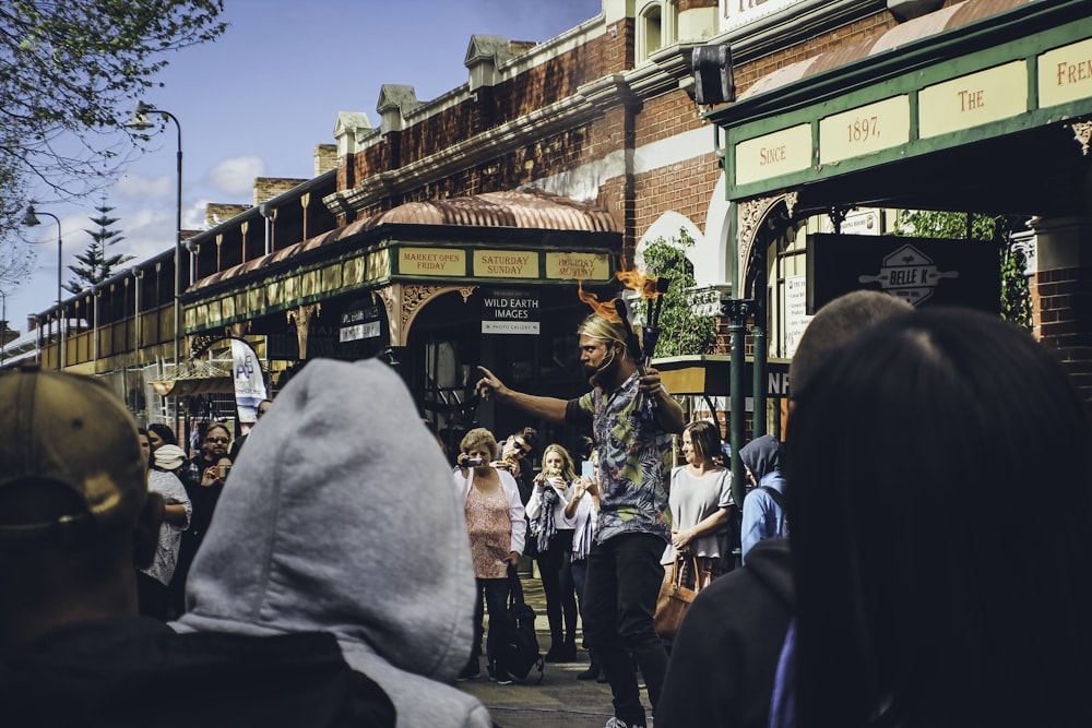 a group of people standing outside of a building