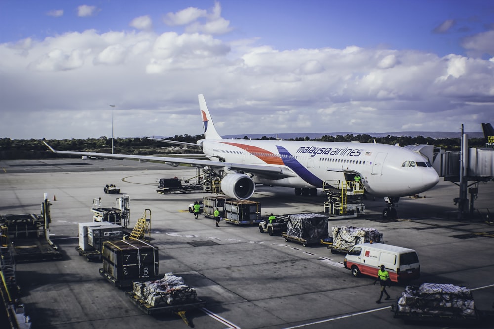 a large jetliner sitting on top of an airport tarmac