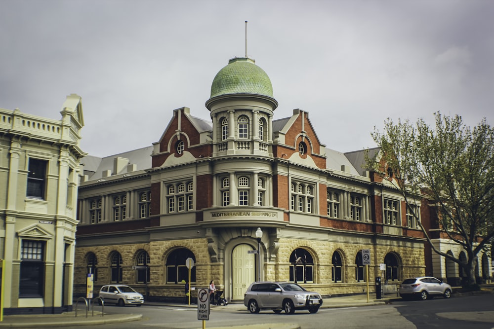 a large building with a green dome on top of it