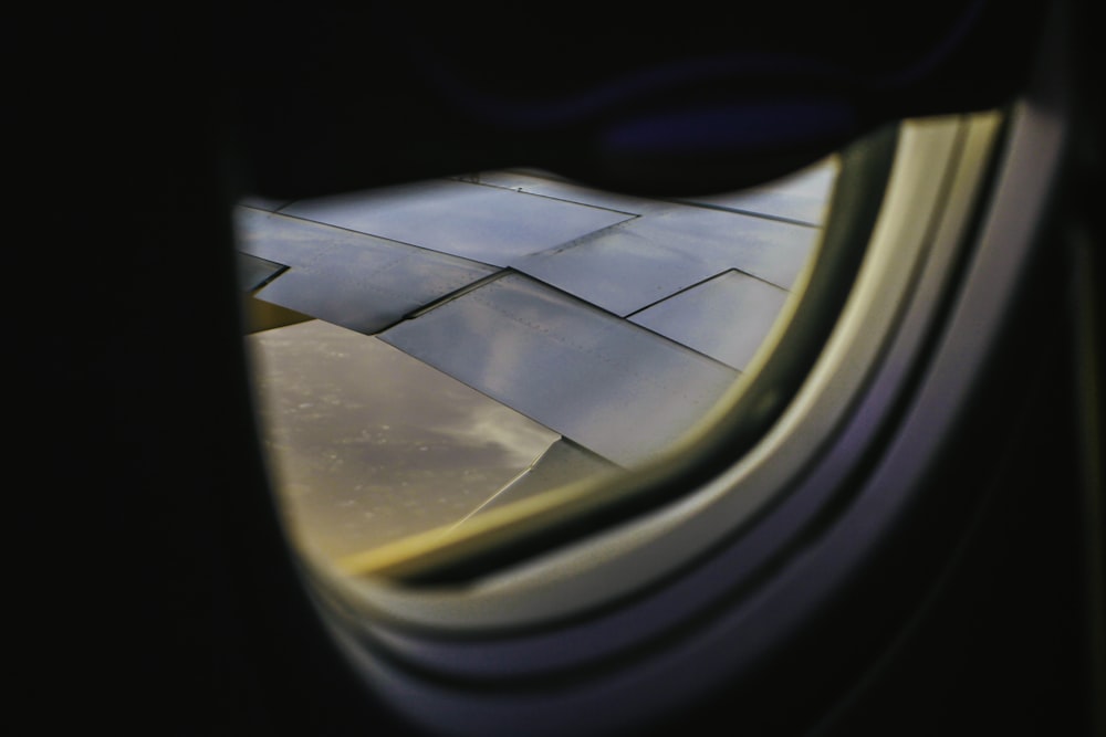 a view of the wing of an airplane through a window