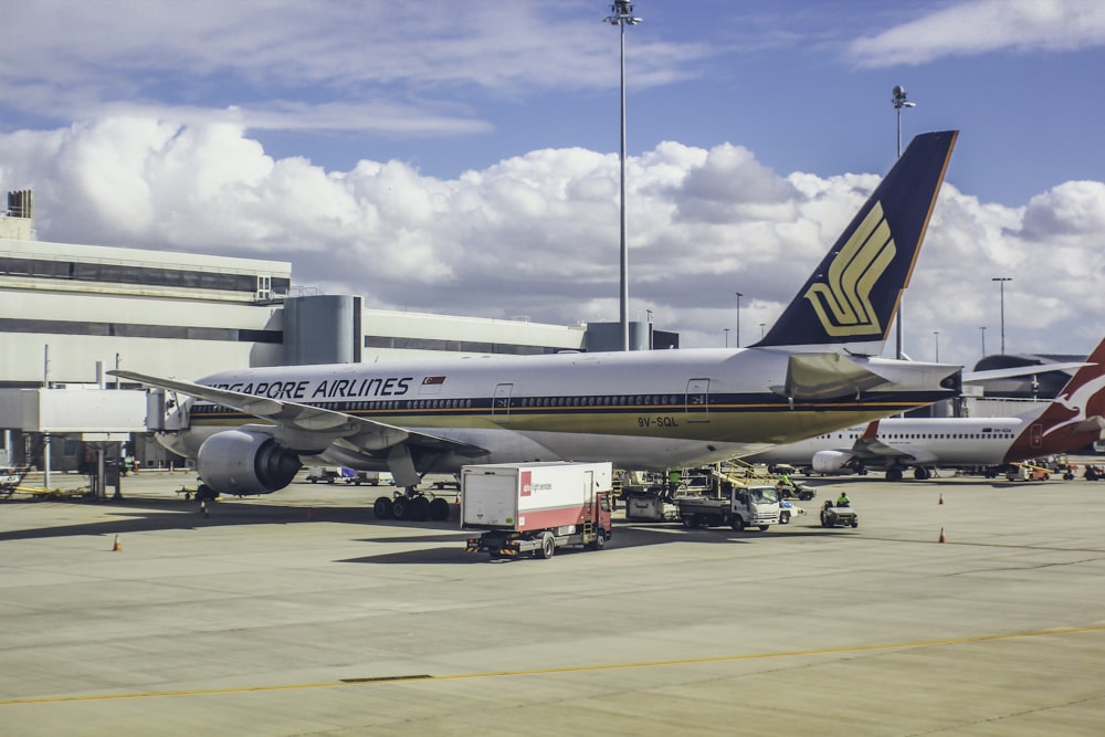 a large jetliner sitting on top of an airport tarmac