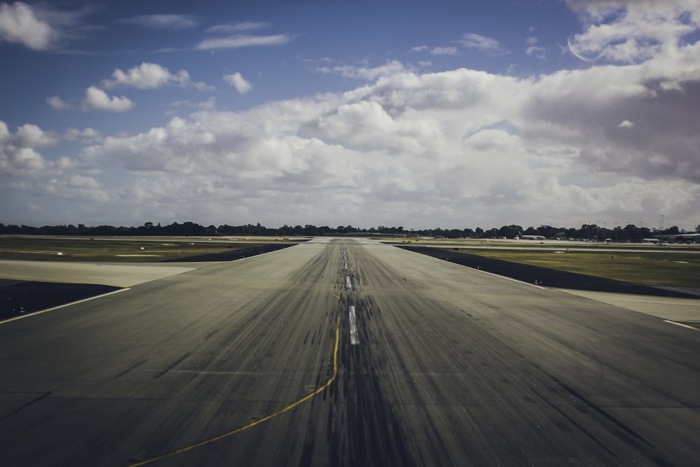 an airplane is taking off from an airport runway