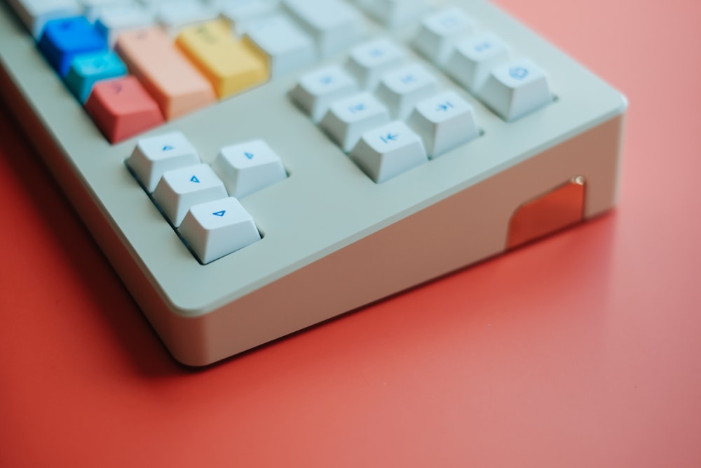 a calculator sitting on top of a red table