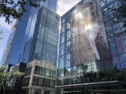 Modern high-rise buildings reflecting sunlight in an urban setting