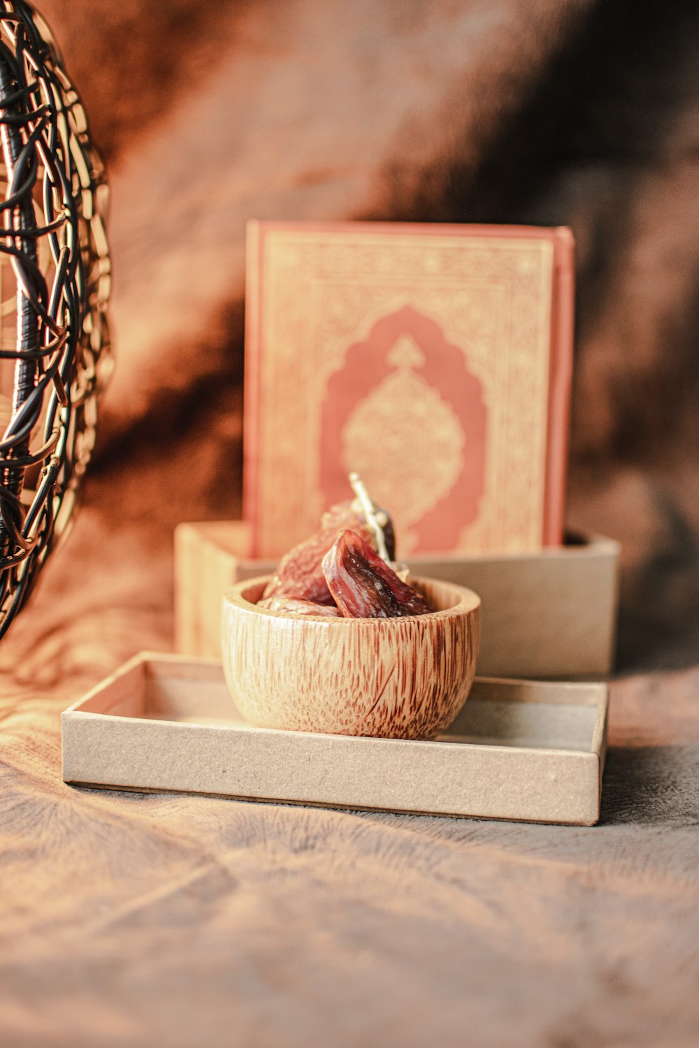 a bowl of fruit sitting on top of a wooden tray