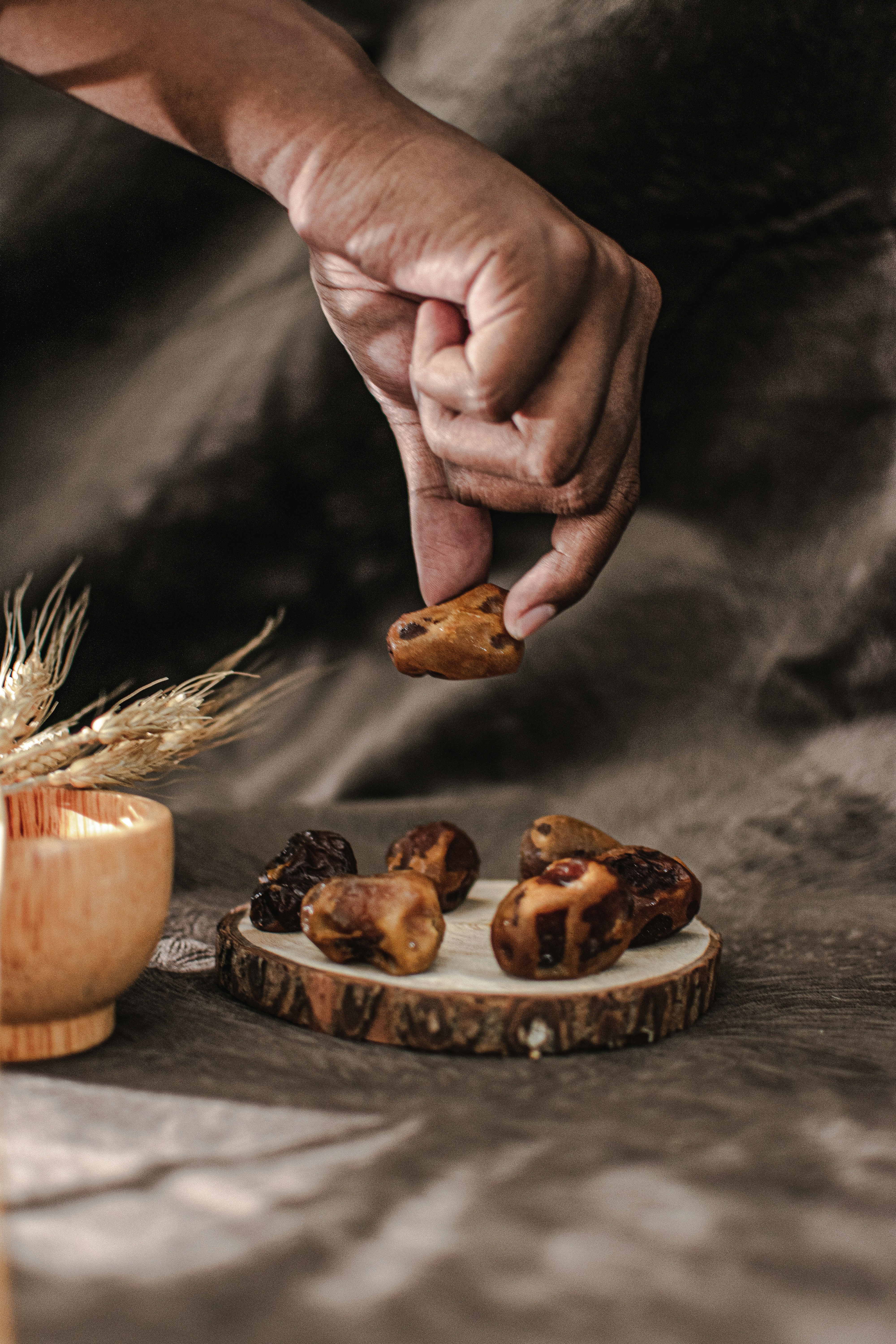 a person reaching for some food on a table