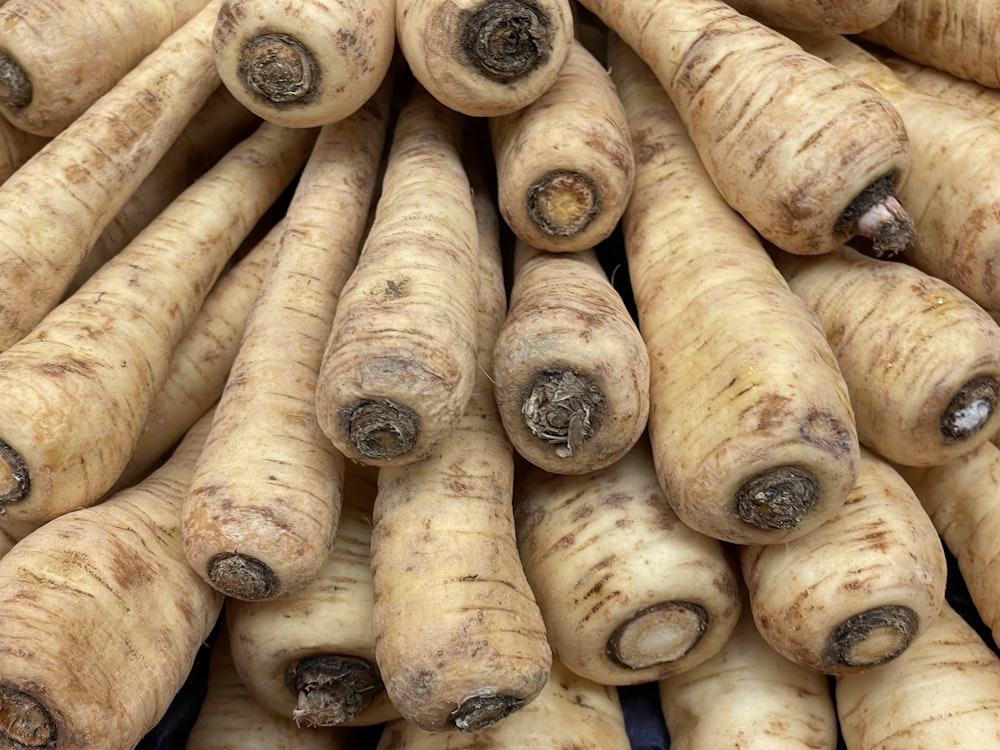 a pile of freshly dug up turnips sitting next to each other