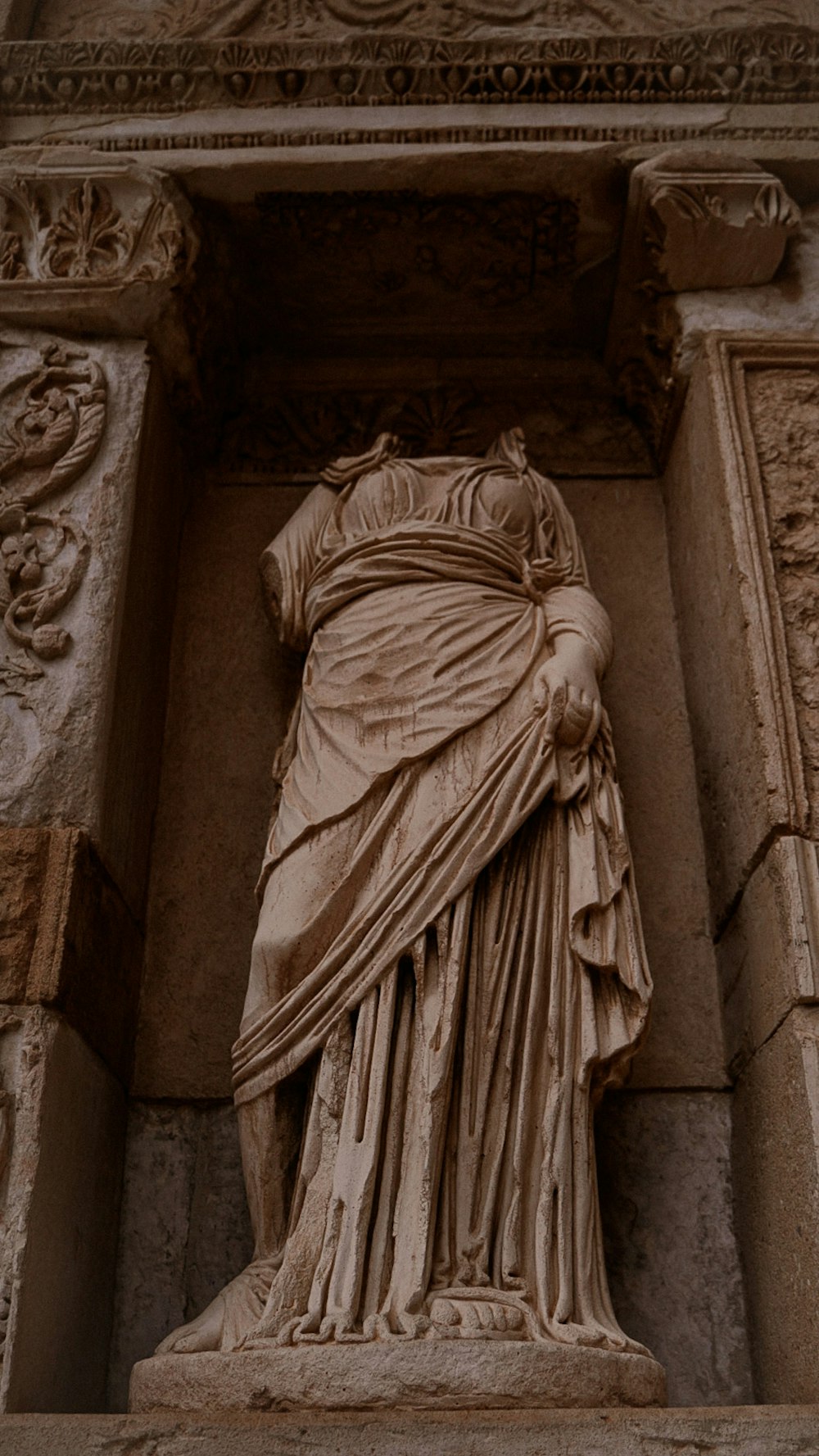 a statue of a woman with a veil on her head