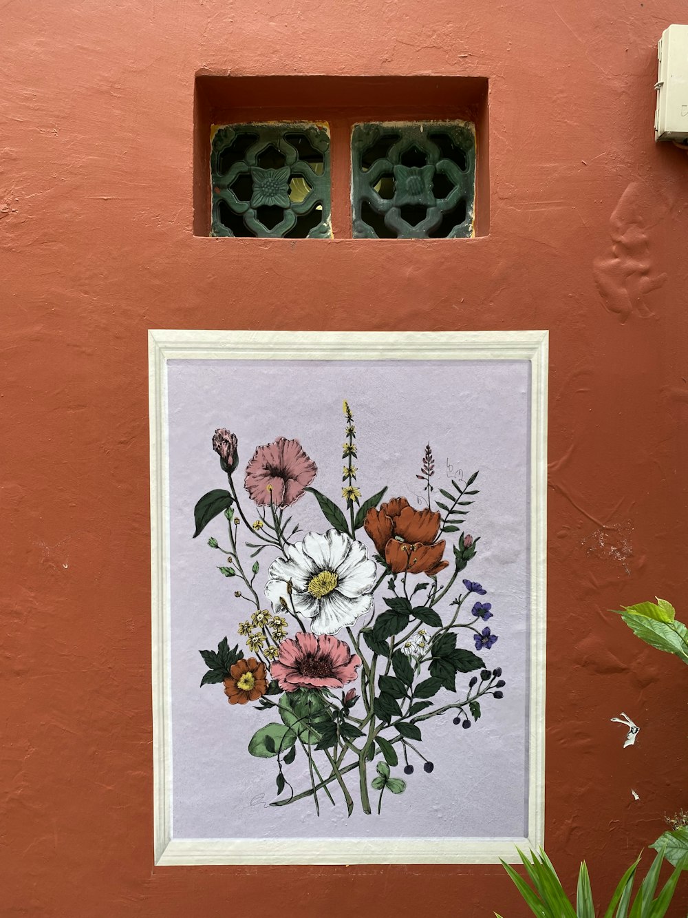 a picture of a bouquet of flowers on a wall