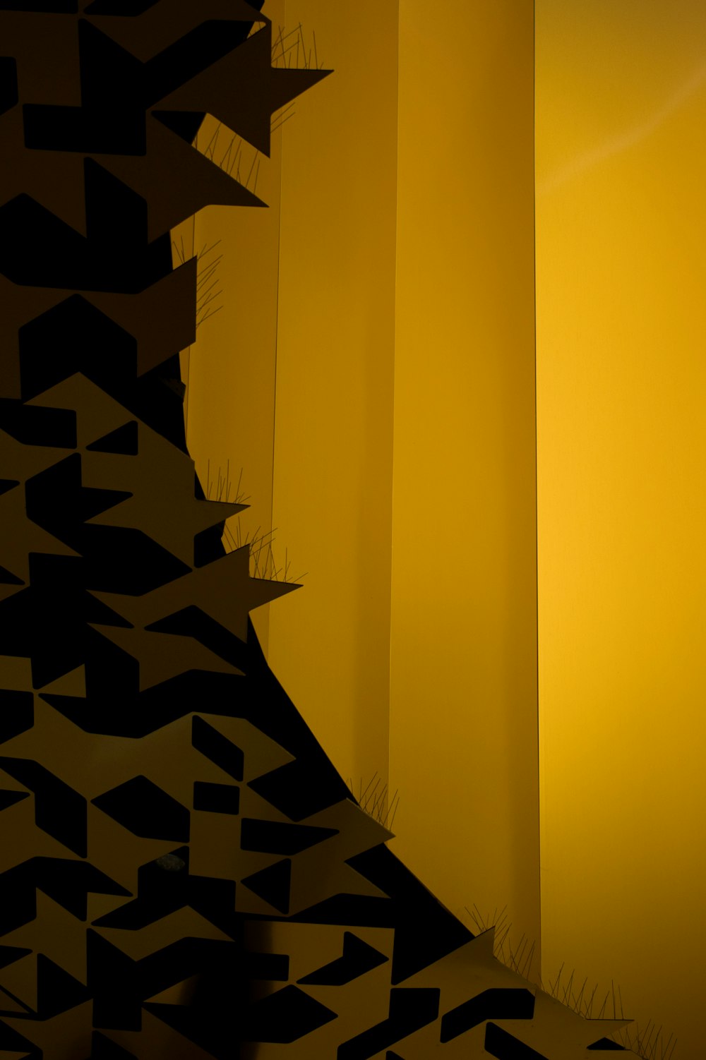 a black and yellow photo of a wall