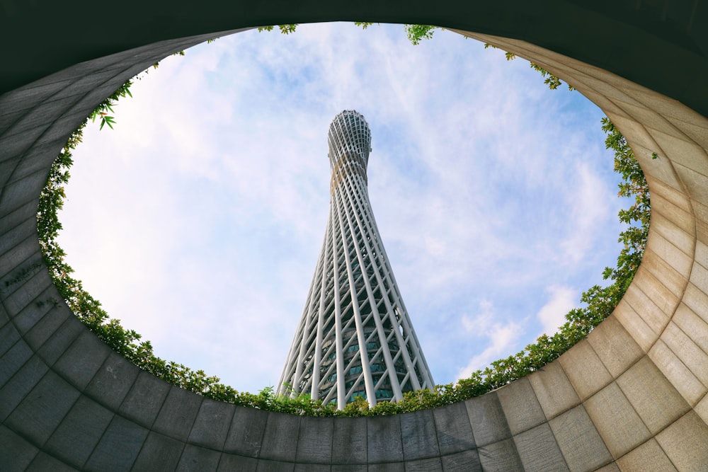 a view of a tall building from the ground