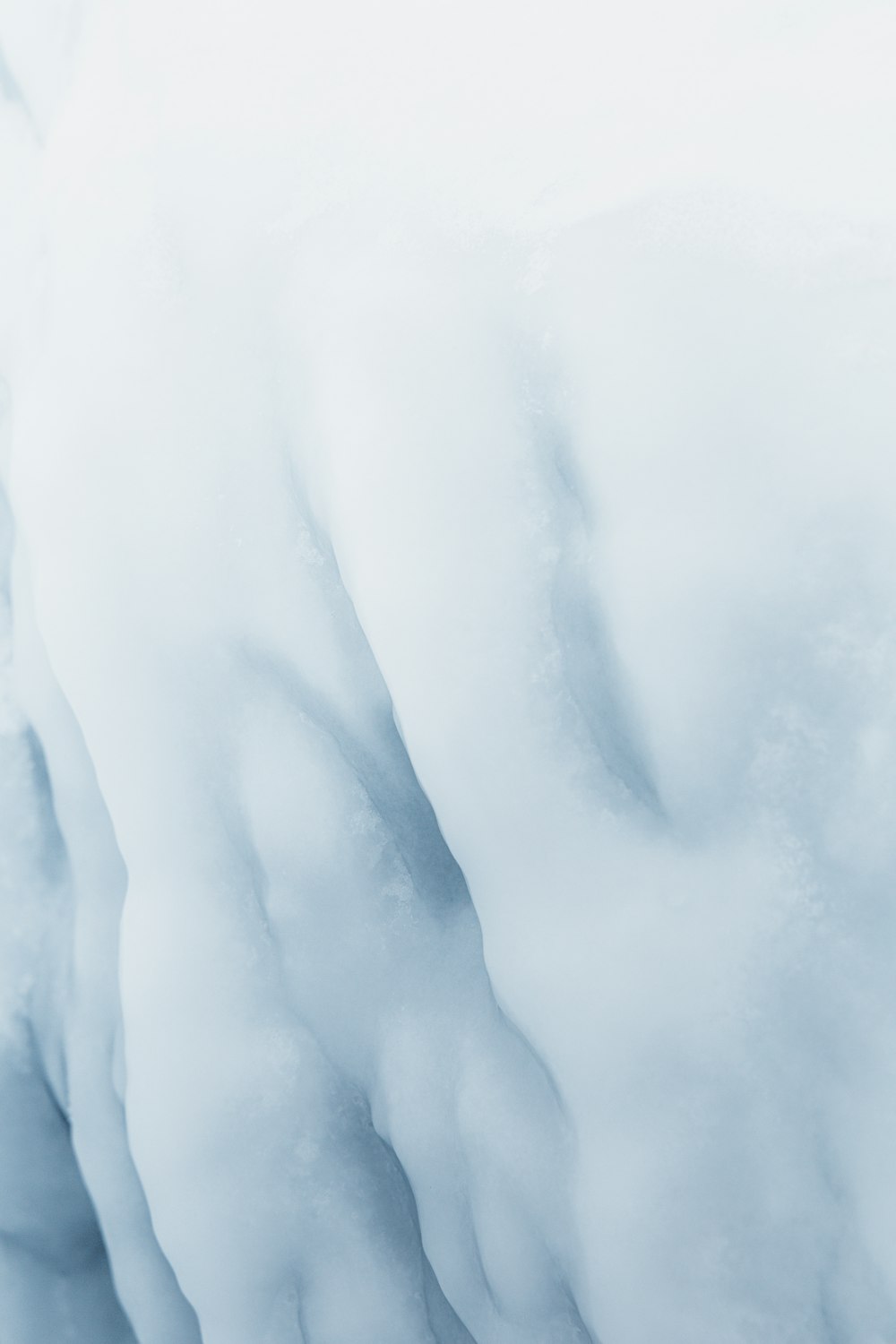 a large iceberg with snow on it's sides