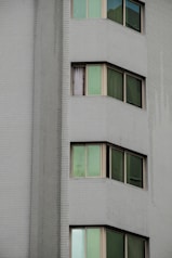 a tall white building with lots of windows