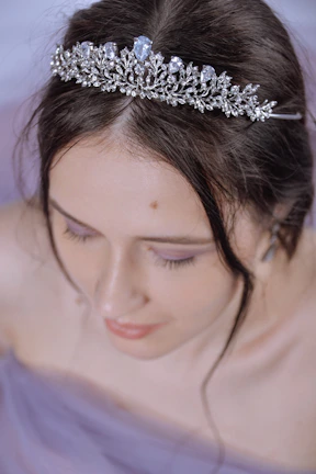 Close-up of The Empress’s crown adorned with stars, glowing softly.
