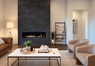 a living room filled with furniture and a fire place