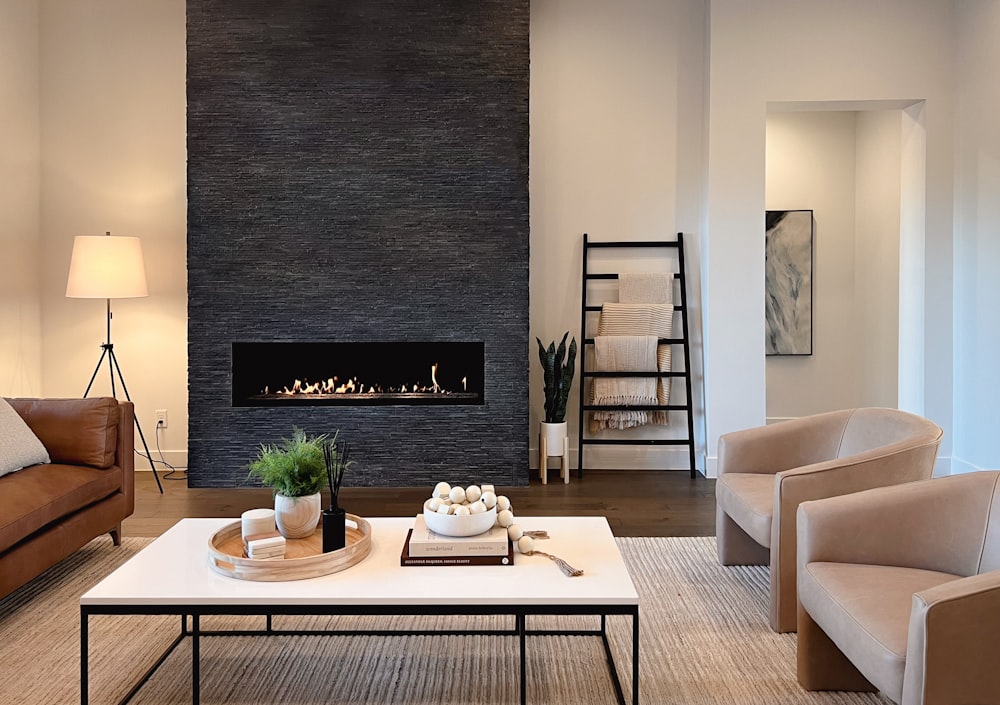 a living room filled with furniture and a fire place