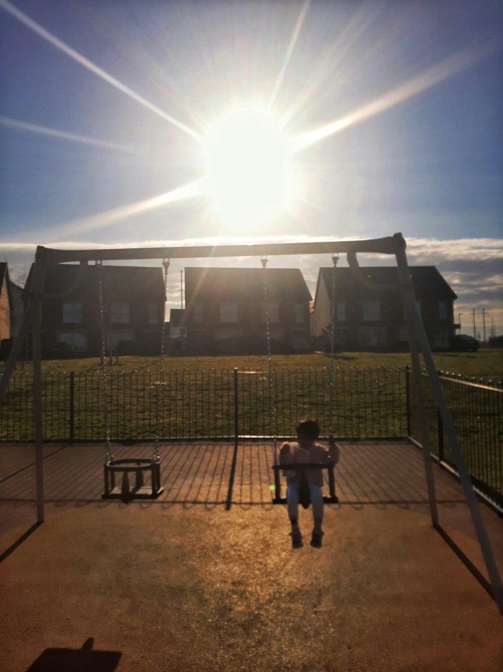 a person sitting on a bench in front of a soccer goal