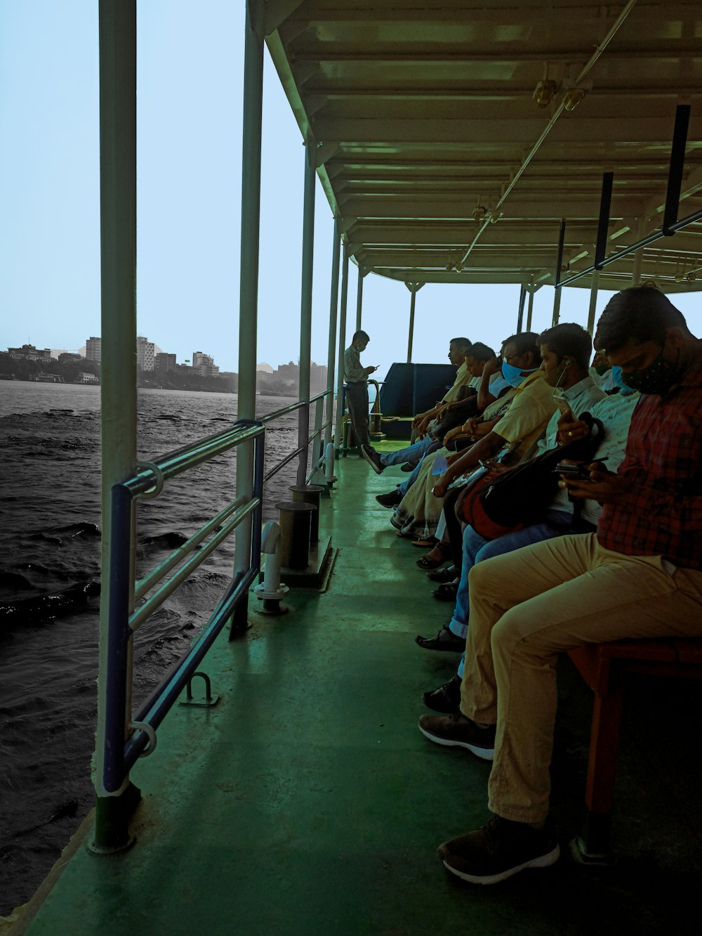 a group of people sitting on top of a boat