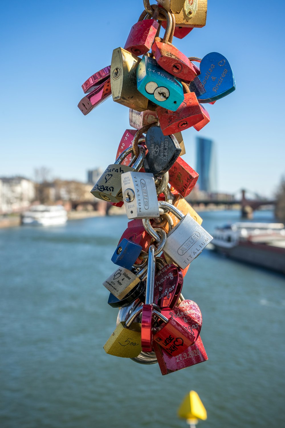 a bunch of locks attached to a pole